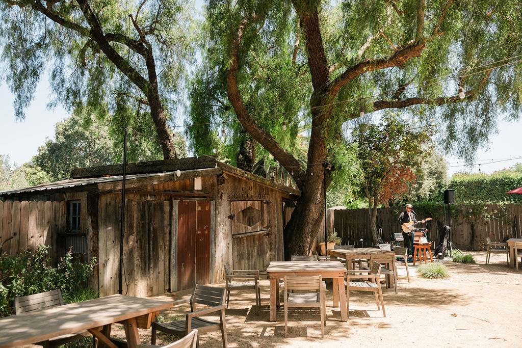 Tables beneath the garden trees