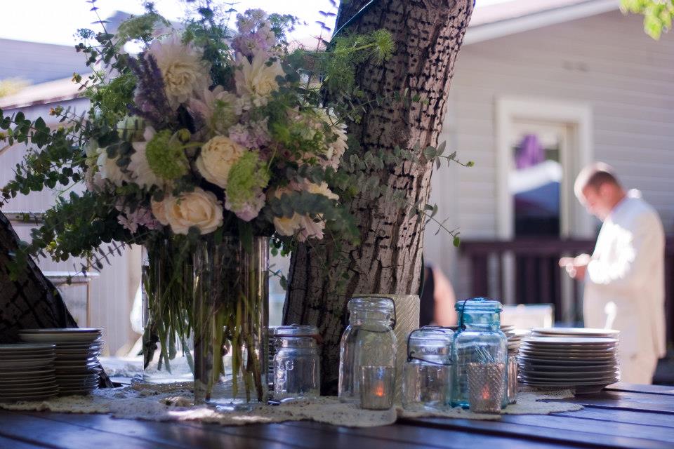 Wedding flowers beside a tree in the garden
